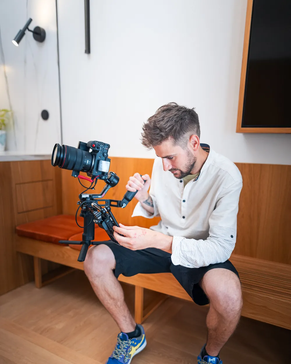 Tomáš Berka setting up a camera on a gimbal before a take